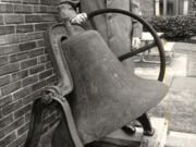 Although blind, Emil Fries (pronounced "freeze") founded The Piano Hospital in 1949 and directed it until 1997. He stands next to the dinner bell that once rang students to meals. Students from around the world sought out his tuning technique that harmonized hands and ears to tune pianos.