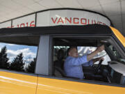 Sales manager Tony Pryor looks over the interior of a 2021 Ford Bronco while posing for a media photo at Vancouver Ford on Tuesday morning.