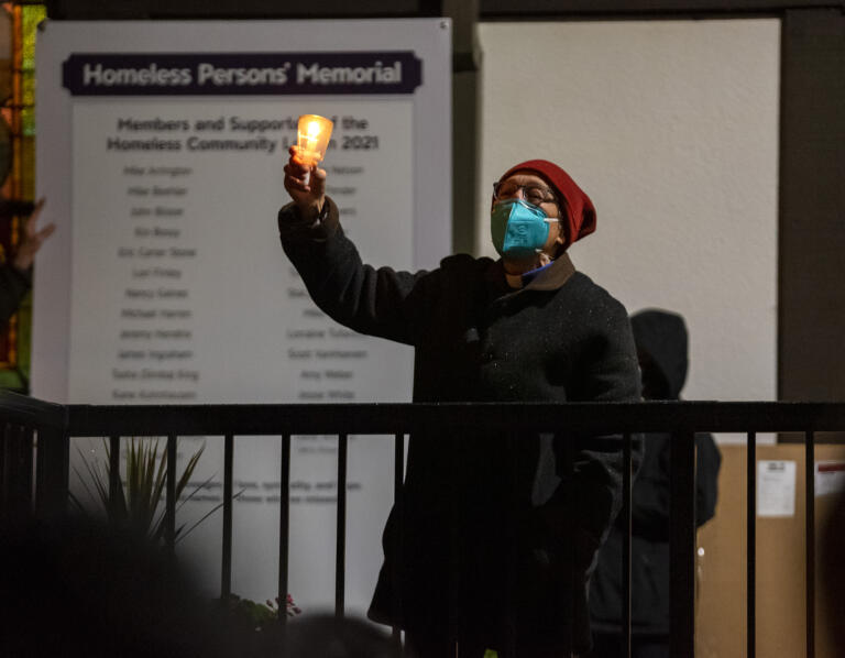 St. Paul Lutheran Church pastor Linda Marousek leads a crowd in song Tuesday, Dec.