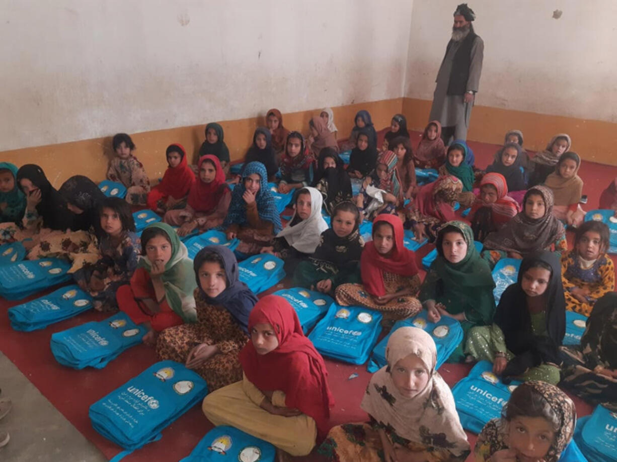 Girls receive backpacks from the United Nations Children's Fund, also known as UNICEF.