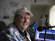 Gerald Gaule operates his one-man radio network from his apartment, where he has been working remotely for years -- trying to keep the radio business alive.