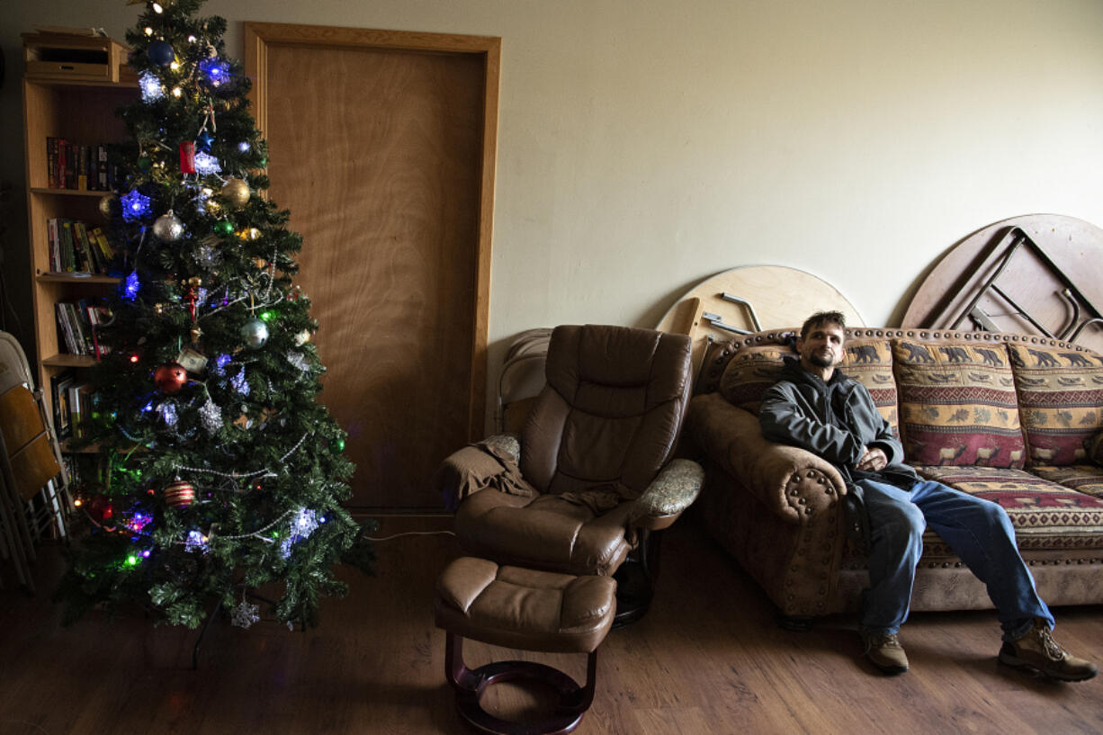 Client Uriah Schlosser of Vancouver keeps out of the cold as he takes a seat at the St. Paul Lutheran Church warming shelter Wednesday afternoon.