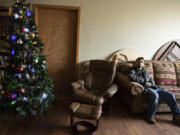 Client Uriah Schlosser of Vancouver keeps out of the cold as he takes a seat at the St. Paul Lutheran Church warming shelter Wednesday afternoon.