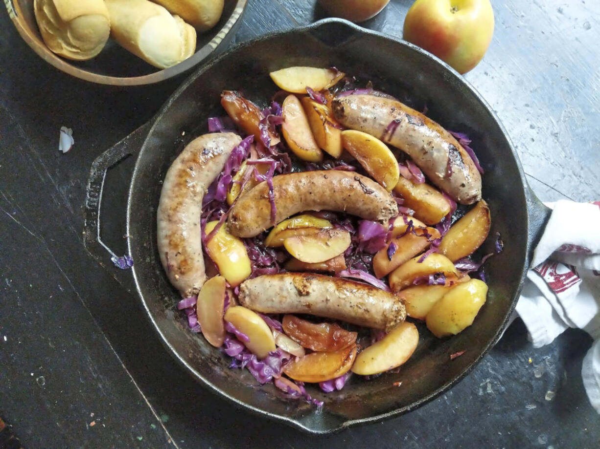 Sweet Italian sausage sizzles in the same pan as sliced apple and red cabbage in this easy skillet recipe.