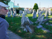 Gravestone conservator Joe Ferrannini at the Har Nebo Cemetery in Philadelphia's Oxford Circle neighborhood. He is repairing and resetting monuments there as a pilot program the Jewish Federation of Greater Philadelphia hopes will provide a model for conservation at other Jewish burial grounds in and around the city.