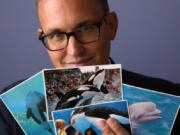 Matthew Strugar, an animal and civil rights attorney who sued SeaWorld several years ago over captive orcas, shows some of the many mysterious postcards he later received.