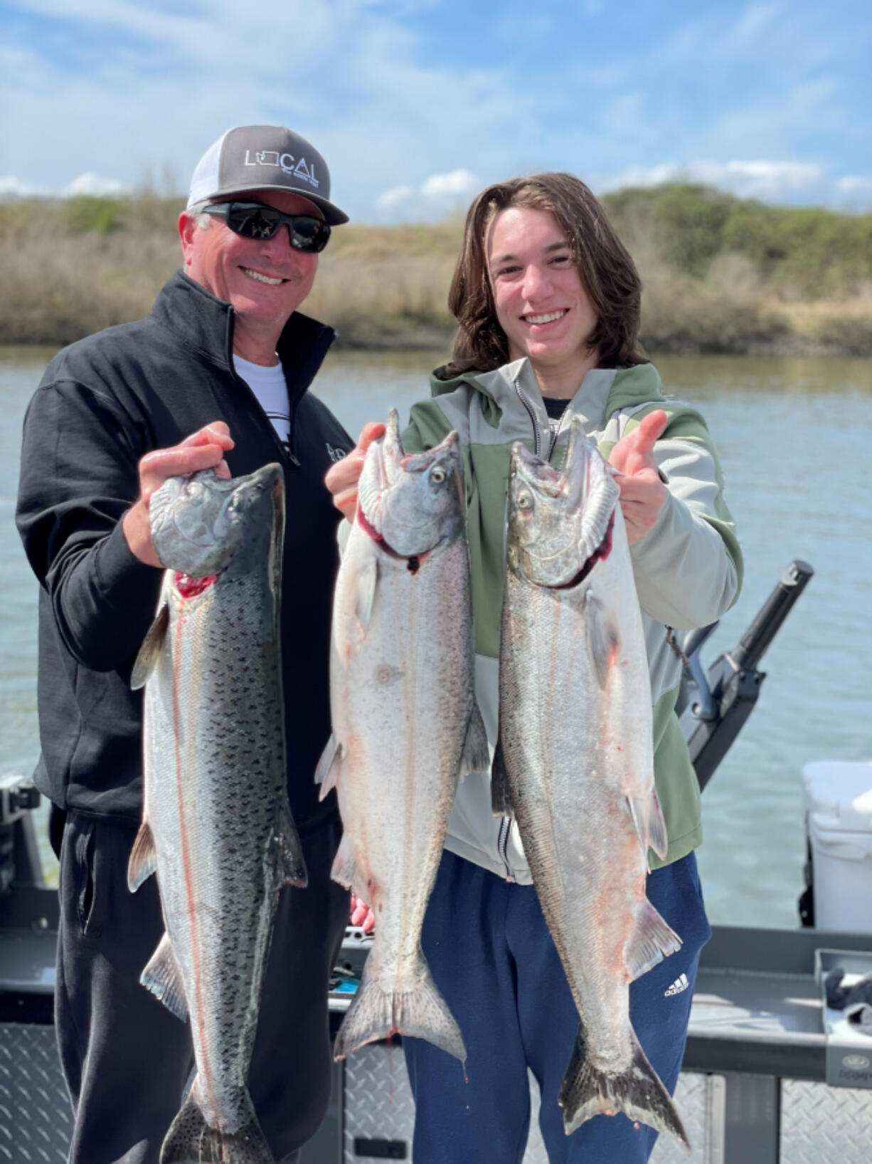 Happy clients with spring Chinook they caught while fishing with guide Matt Eleazer of East Fork Outfitters last year. With the runs improving in almost all waters, local anglers should be in store for much better fishing this spring and summer.