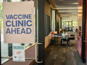 A pharmacist waits for patients at a COVID-19 vaccination clinic on the University of Washington campus on May 18 in Seattle.