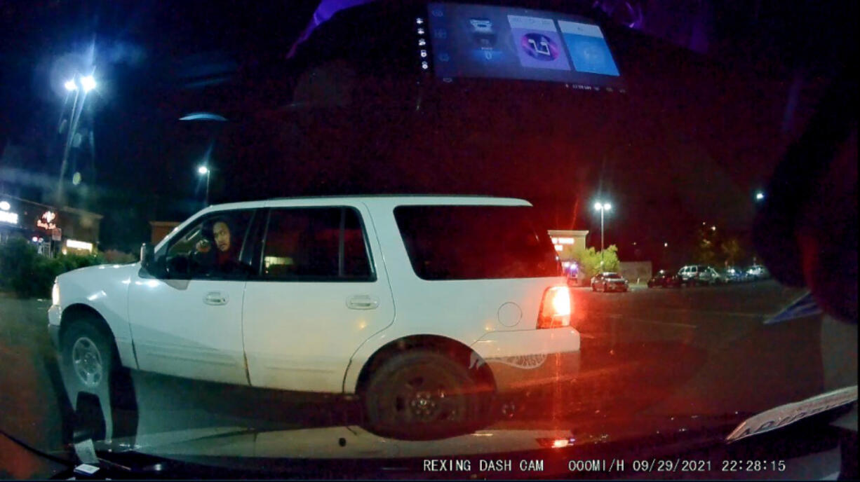 A dash camera image shows Kfin Karuo allegedly pointing a gun at a man Sept. 29 in an east Vancouver parking lot.