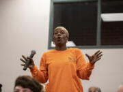 Nickeia Hunter poses a question regarding police brutality at Clark College's Foster Hall auditorium during a Police Executive Research Forum on Sept. 11, 2019. Hunter, whose brother was fatally shot by Vancouver police officers in March 2019 in Hazel Dell, was recently appointed to the 16-member Washington State Criminal Justice Training Commission.