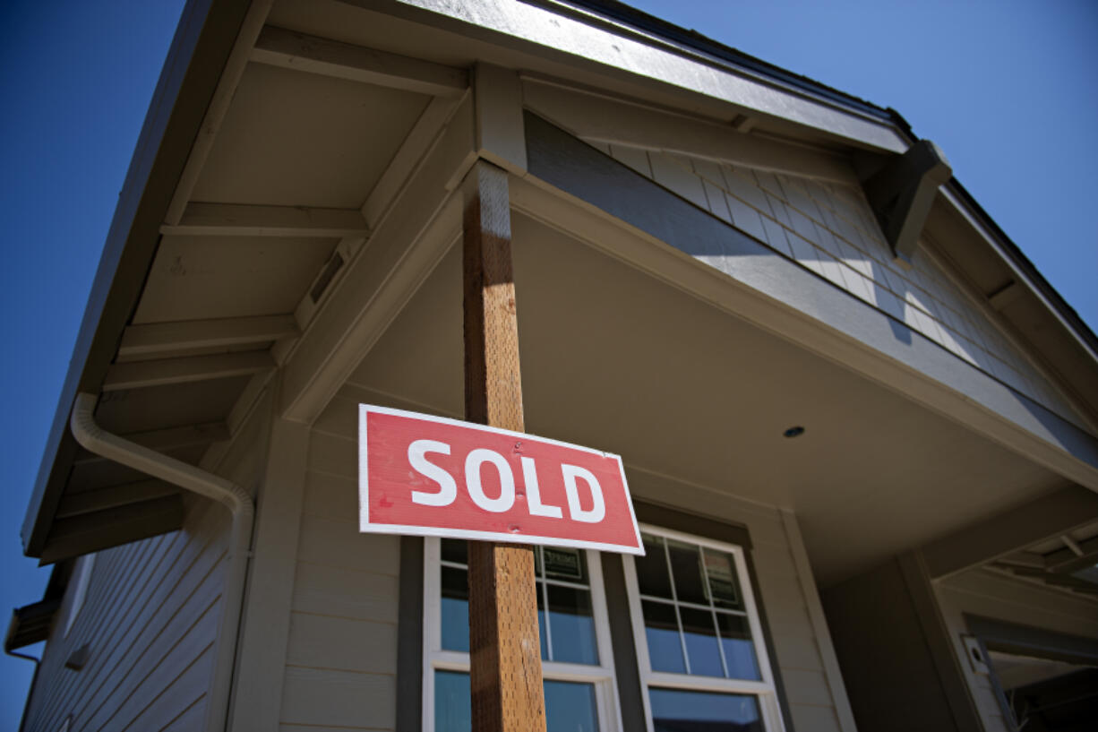 The median home sale price in November came in at $483,500, $1,500 less than the median sale price in October. However, the same metric was $410,000 in November of last year. A sign outside a new home in Kennedy Farm in July lets homebuyers know the property's status in Ridgefield.