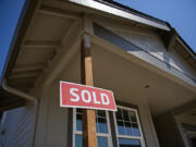 The median home sale price in November came in at $483,500, $1,500 less than the median sale price in October. However, the same metric was $410,000 in November of last year. A sign outside a new home in Kennedy Farm in July lets homebuyers know the property's status in Ridgefield.