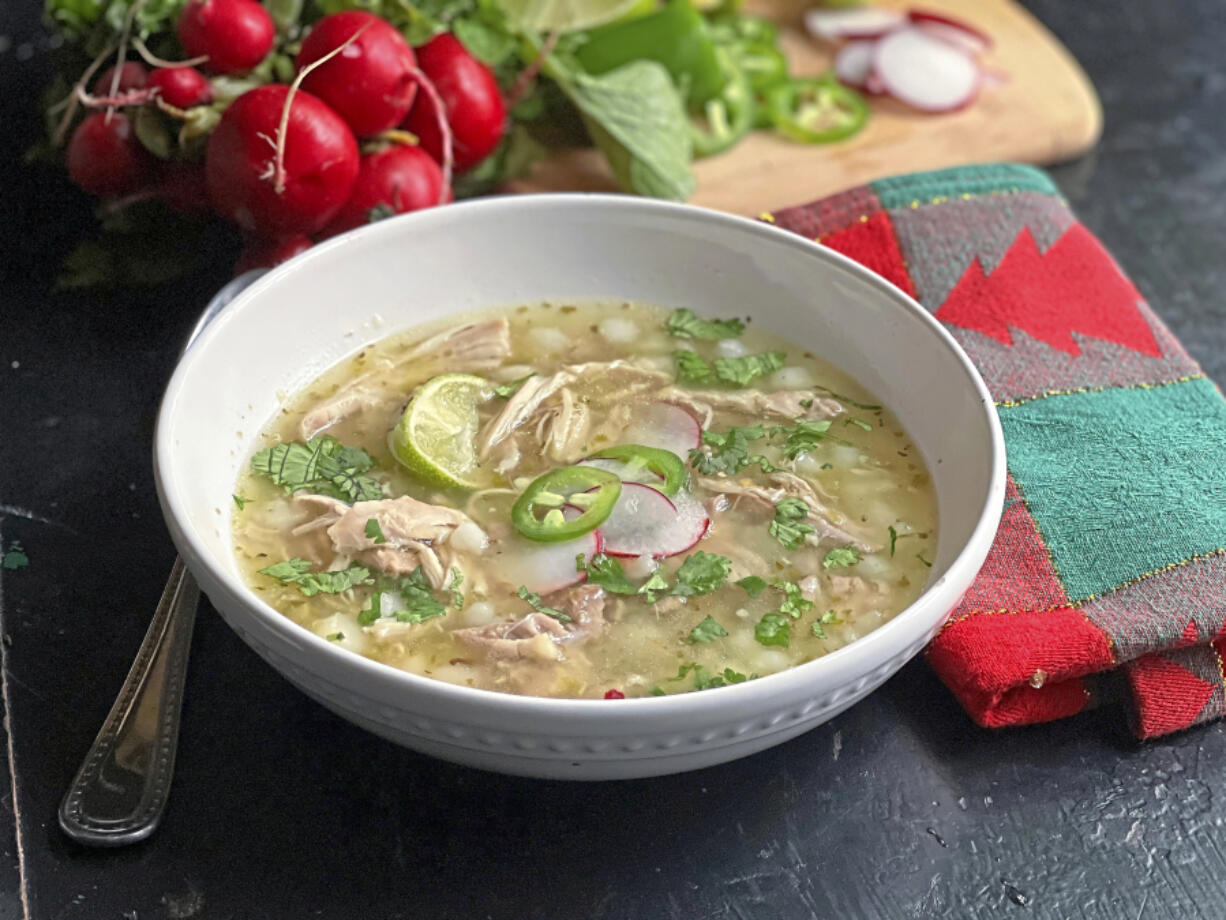 Hot and nourishing, this easy chicken pozole is made with jarred salsa verde.