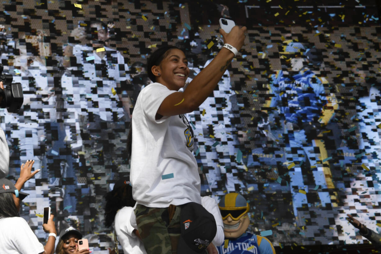 Chicago Sky forward/center Candace Parker (3) takes a selfie as teammates celebrate their 2021 WNBA Championship during a rally at Millennium Park on Tuesday, Oct. 19, 2021, in Chicago.