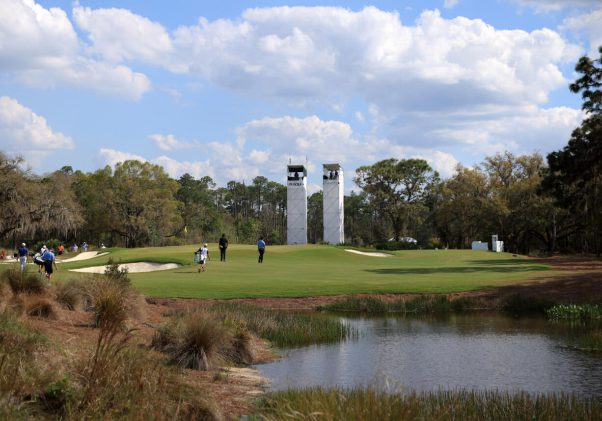 Golfers walk the 14th hole at The Concession in Bradenton, Fla., in February. The lure of Florida's abundant beaches and golf courses offered COVID-safe relaxation in 2021 for travelers.