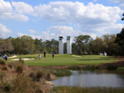 Golfers walk the 14th hole at The Concession in Bradenton, Fla., in February. The lure of Florida's abundant beaches and golf courses offered COVID-safe relaxation in 2021 for travelers.