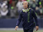 Seattle Seahawks head coach Pete Carroll looks toward the scoreboard during the first half of an NFL football game against the San Francisco 49ers, Sunday, Dec. 5, 2021, in Seattle.