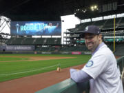 Seattle Mariners pitcher Robbie Ray poses for a photo in the dugout at T-Mobile Park, Wednesday, Dec. 1, 2021, following a news conference in Seattle. The AL Cy Young Award winner — who previously pitched for the Toronto Blue Jays — signed a five-year contract with the Mariners. (AP Photo/Ted S.