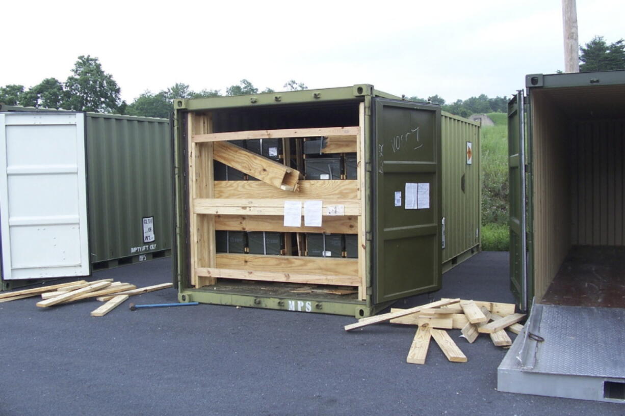 FILE - In this July 13, 2017, image provided by the U.S. Army Criminal Investigation Command on Feb. 9, 2021, a storage container of explosive ordnance shows signs of theft after arriving at the Letterkenny Army Depot in Chambersburg, Pa. An ammunition canister containing 32 rounds of 40mm M430A1 grenades, property of the U.S. Marine Corps, was missing. (U.S.