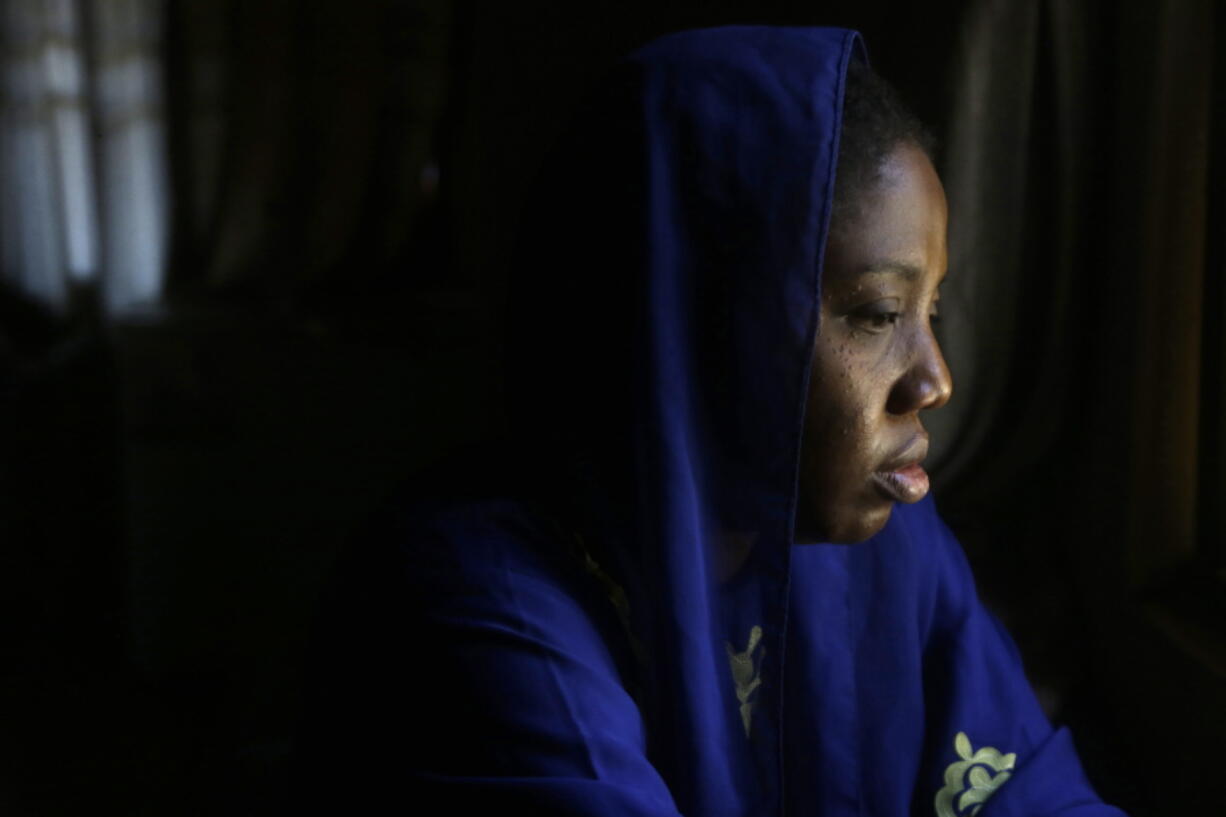 Amina Ahmed, the wife of Muhammad Mubarak Bala, an atheist who has been detained since April 2020, is photograph in her home in Abuja, Nigeria, Sunday, Nov. 21, 2021. Bala was held incommunicado in police custody for so long -- eight months -- that Ahmed was sure he was dead. "I couldn't eat. I couldn't sleep. The emotional torture was too much for me," she says.