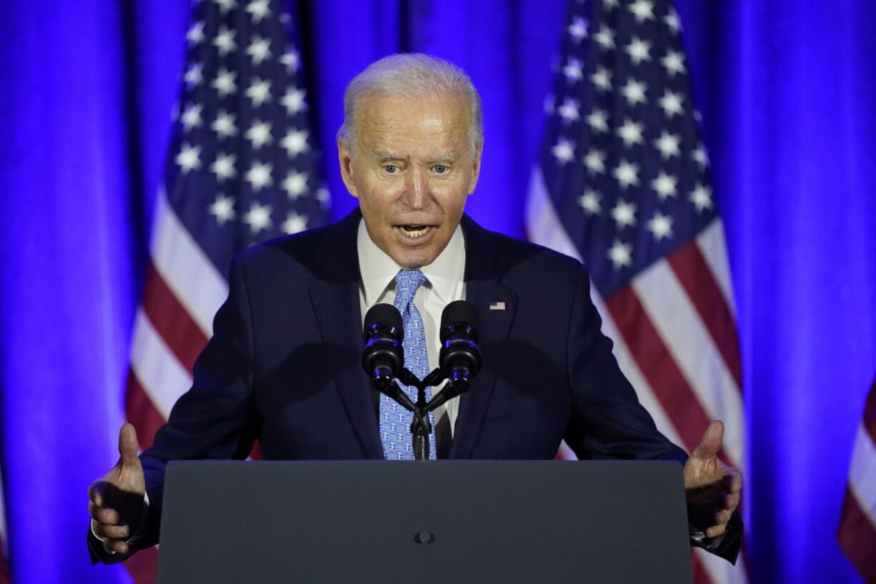 President Joe Biden speaks at a Democratic National Committee holiday party, Tuesday, Dec. 14, 2021, in Washington.