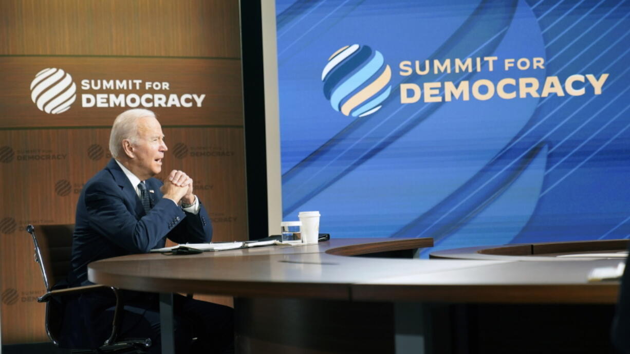 President Joe Biden speaks from the South Court Auditorium on the White House complex in Washington, Thursday, Dec. 9, 2021, for the opening of the Democracy Summit.The two-day virtual summit is billed as an opportunity for leaders and civil society experts from some 110 countries to collaborate on fighting corruption and promoting respect for human rights.