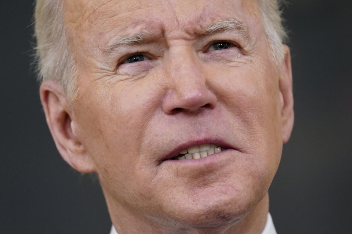 President Joe Biden speaks about the COVID-19 response and vaccinations, Tuesday, Dec. 21, 2021, in the State Dining Room of the White House in Washington.