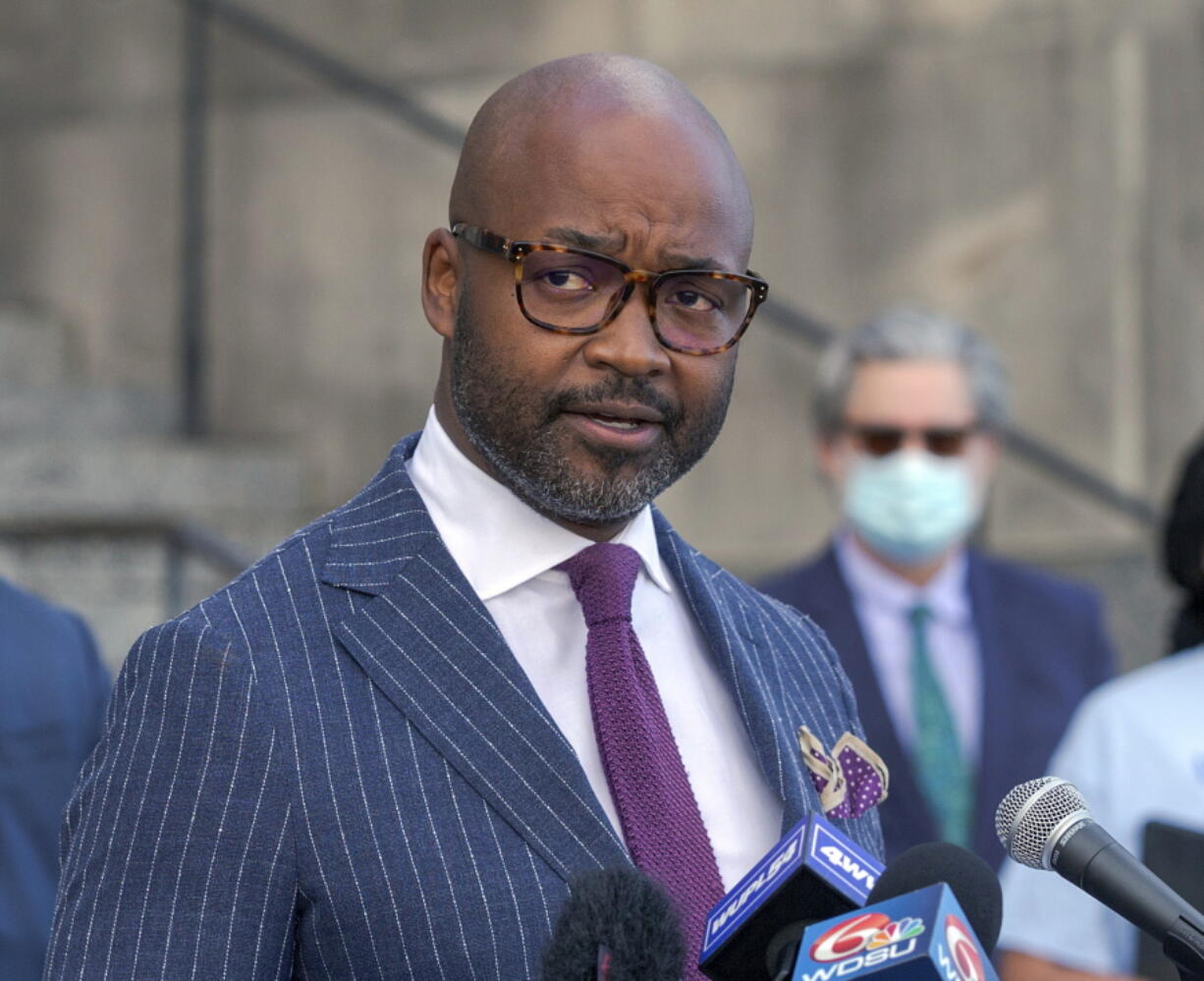 FILE - New Orleans District Attorney Jason Williams talks with the media, Feb. 26, 2021 in New Orleans. A suspect has been identified and charged in the 2016 shooting death of a St. Louis man visiting New Orleans to plan his wedding. District Attorney Jason Williams announced the arrest Thursday, Dec. 16, 2021 of 44-year-old Ernest Weatherspoon in the death of Thomas Rolfes.