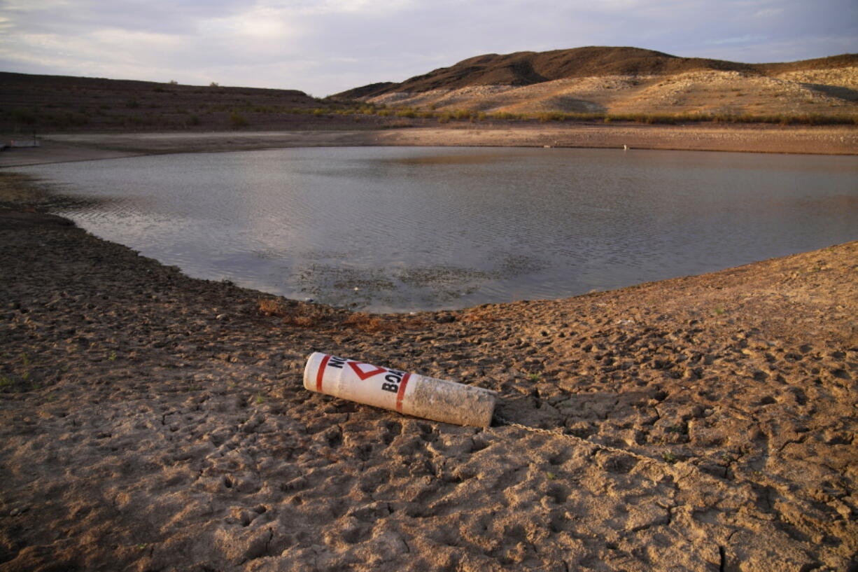 A buoy rests on the ground at a closed boat ramp on Lake Mead at the Lake Mead National Recreation Area near Boulder City, Nev., on Aug. 13.