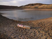 A buoy rests on the ground at a closed boat ramp on Lake Mead at the Lake Mead National Recreation Area near Boulder City, Nev., on Aug. 13.