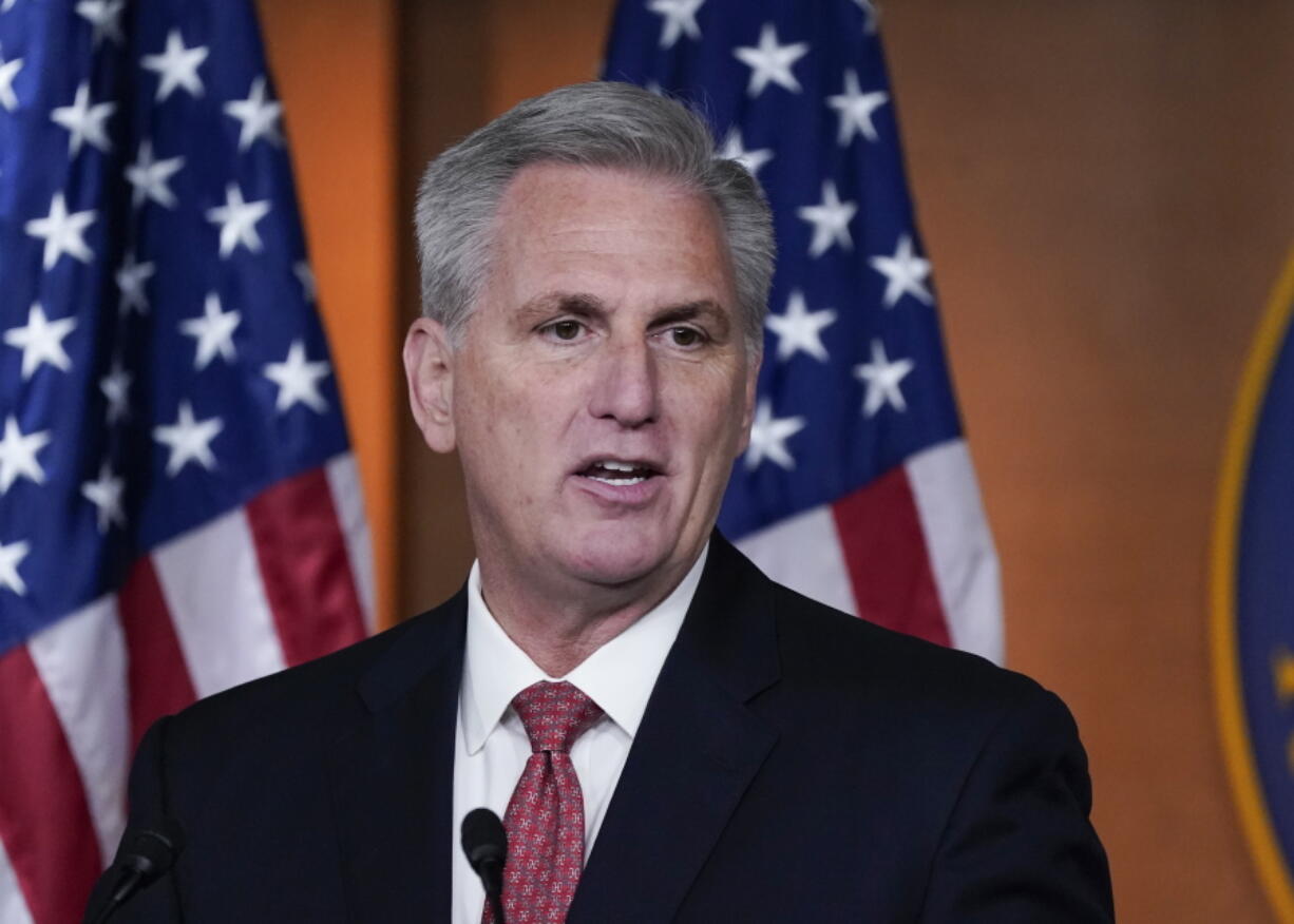 FILE - House Minority Leader Kevin McCarthy, R-Calif., responds to reporters at the Capitol in Washington, Dec. 3, 2021, about the behavior of Rep. Lauren Boebert, R-Colo. McCarthy appears to have settled on a strategy to deal with a handful of Republican lawmakers who have stirred outrage with violent, racist and sometimes Islamophobic comments. If you can't police them, promote them. (AP Photo/J.