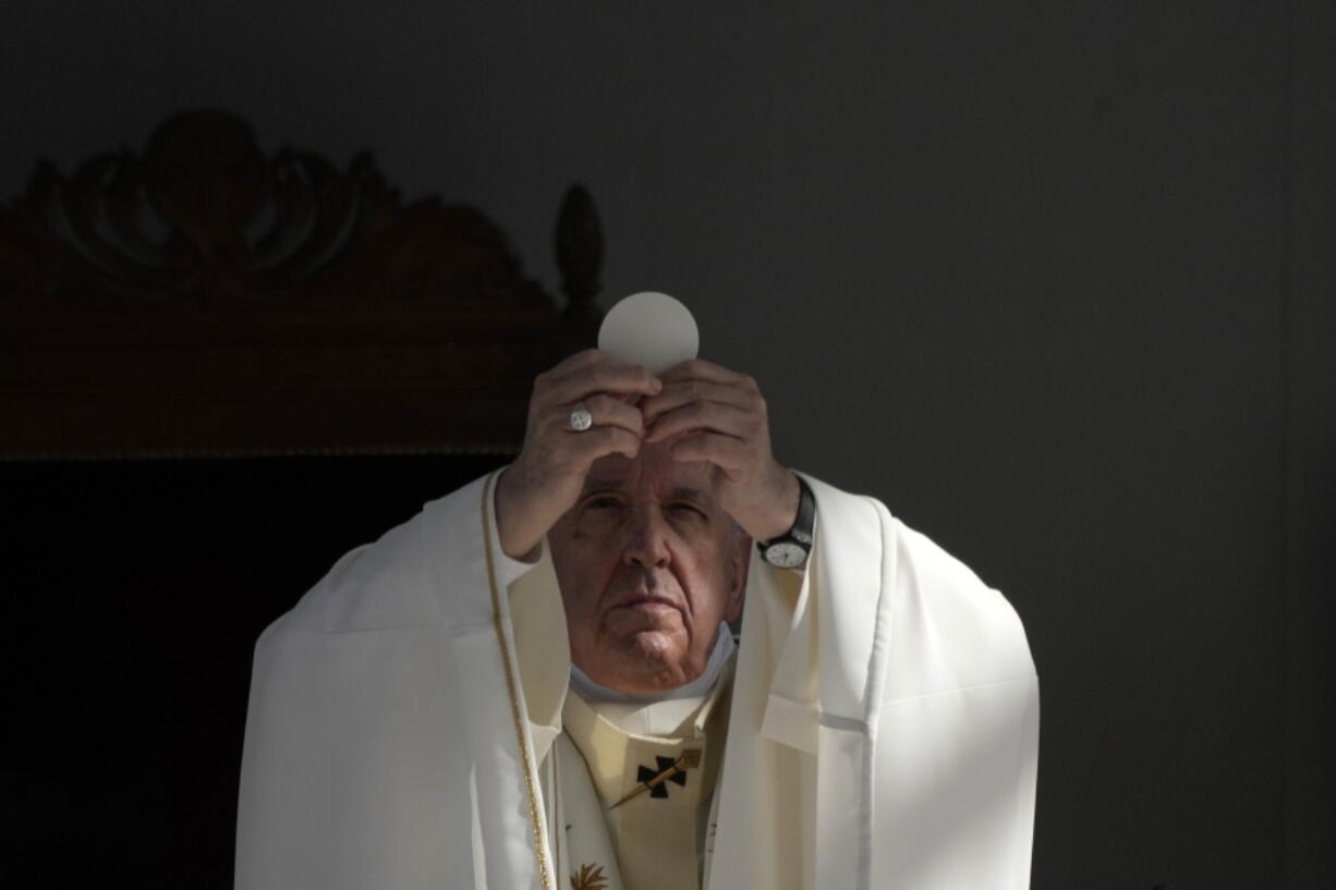 Pope Francis leads a holy mass at GSP stadium in Nicosia, Cyprus, Friday, Dec. 3, 2021. Francis is on a five-day trip to Cyprus and Greece by drawing attention once again to his call for Europe to welcome migrants.