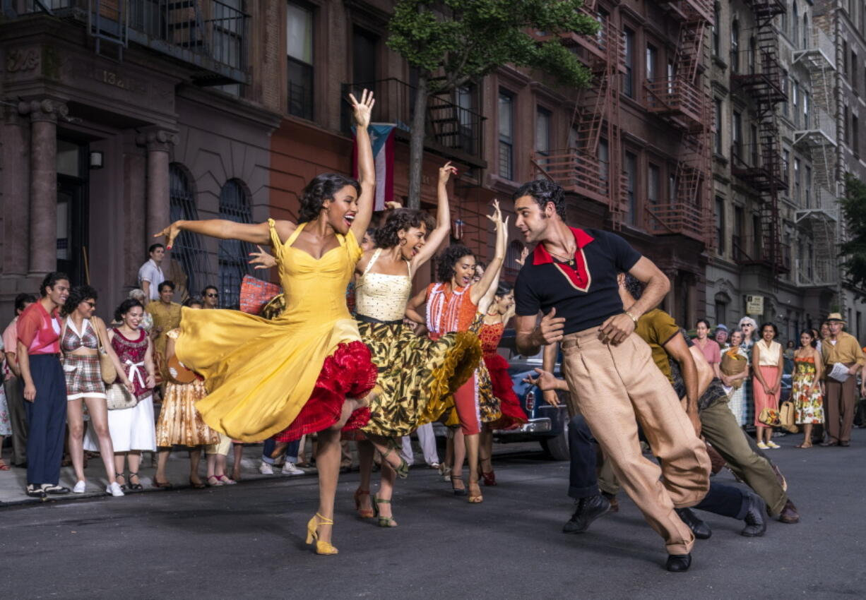 This image released by 20th Century Studios shows Ariana DeBose as Anita, foreground left, and David Alvarez as Bernardo in "West Side Story." (Niko Tavernise/20th Century Studios via AP)