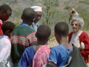 Archaeologist Mary Leakey speaks to Masai schoolchildren on Aug. 16, 1996, at Laetoli, northern Tanzania at the site of 3.6-million-year-old hominid footprints she identified 20 years before.