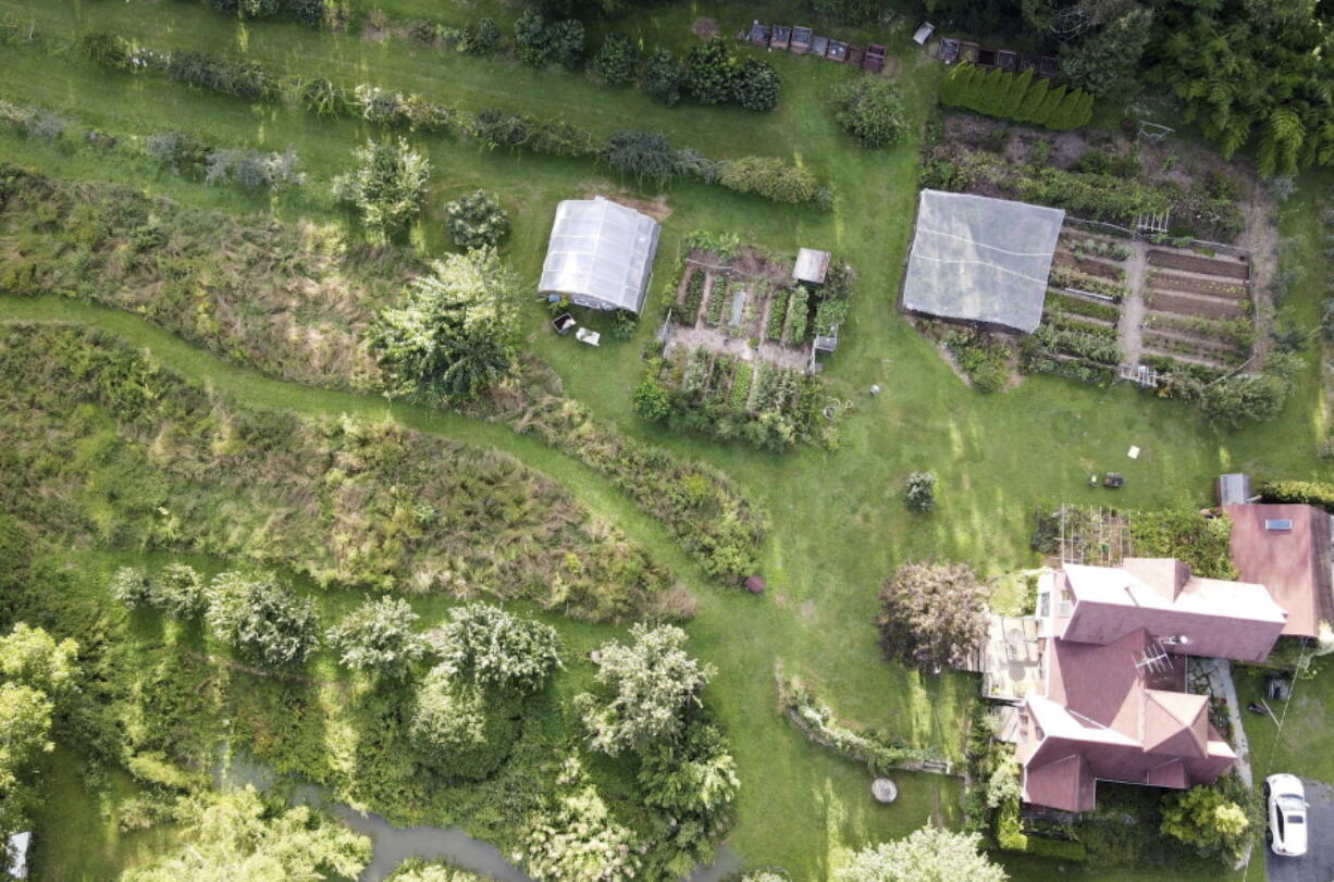 This undated photo shows the garden of writer Lee Reich in New Paltz, NY. A mixed garden of vegetables, flowers, herbs and fruits can please all the senses.