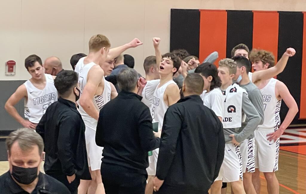 Battle Ground breaks from its post-game huddle after defeating Heritage in the Tigers' home opener Wednesday in Battle Ground.