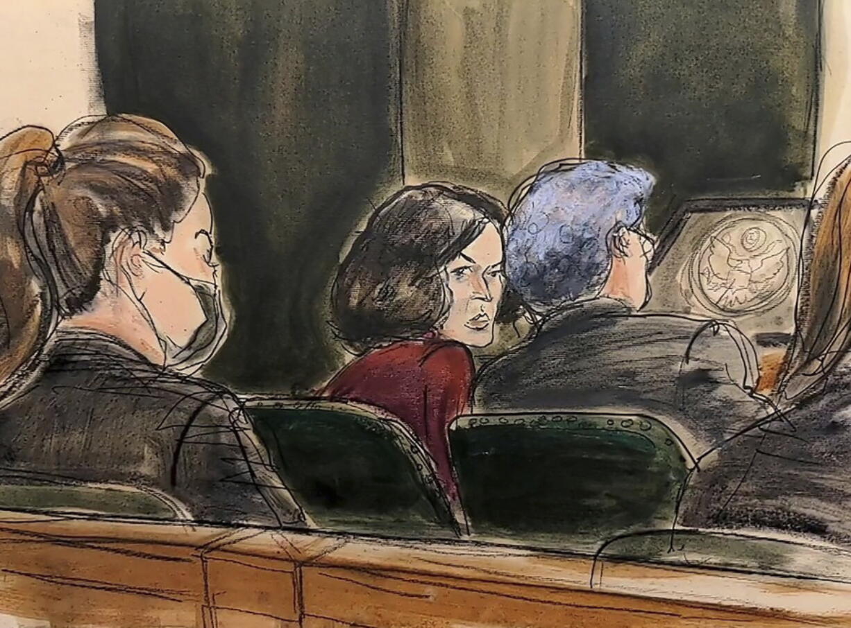 In this courtroom sketch, Ghislaine Maxwell center, confers with her defense attorney Jeffrey Pagliuca, right, before testimony begins in her sex-abuse trial, in New York, Wednesday, Dec. 8, 2021. Testimony continues in the trial of Ghislaine Maxwell, the British socialite accused of helping the millionaire Jeffrey Epstein sexually abuse underage girls.