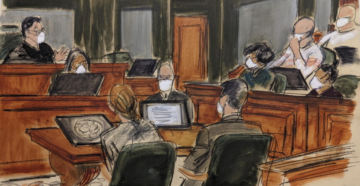 In this courtroom sketch, Judge Alison Nathan, far left, speaks to the jury, right, about the new deliberations schedule and the courts concern regarding the recent COVID-19 outbreak during the Ghislaine Maxwell sexual abuse trial, Tuesday, Dec. 28, 2021, in New York.