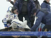 In this photo taken from video footage released by the Roscosmos Space Agency, Russian space agency rescue team help spaceflight participant Yusaku Maezawa to get from the capsule shortly after the landing of the Russian Soyuz MS-20 space capsule about 150 km ( 80 miles) south-east of the Kazakh town of Zhezkazgan, Kazakhstan, Monday, Dec. 20, 2021. The Japanese billionaire, his producer and a Russian cosmonaut safely returned to Earth on Monday after spending 12 days on the International Space Station.