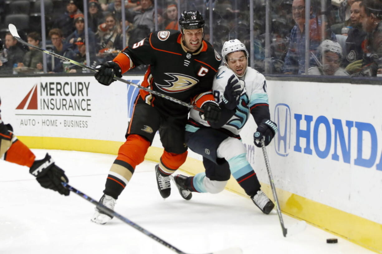 Anaheim Ducks center Ryan Getzlaf, left, collides with Seattle Kraken center Calle Jarnkrok during the first period of an NHL hockey game in Anaheim, Calif., Wednesday, Dec. 15, 2021.