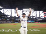 FILE - Seattle Mariners third baseman Kyle Seager waves to fans after a baseball game against the Los Angeles Angels Sunday, Oct. 3, 2021, in Seattle. Seager announced his retirement on Wednesday, Dec. 29, 2021, after 11 seasons in the majors, all with the Mariners.