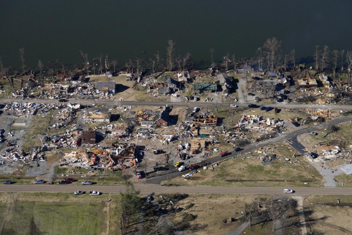 In this aerial photo, destruction is seen along Reelfoot Lake in the aftermath of tornadoes that through the region, in Samburg, Tenn., Sunday, Dec. 12, 2021.