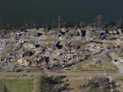 In this aerial photo, destruction is seen along Reelfoot Lake in the aftermath of tornadoes that through the region, in Samburg, Tenn., Sunday, Dec. 12, 2021.