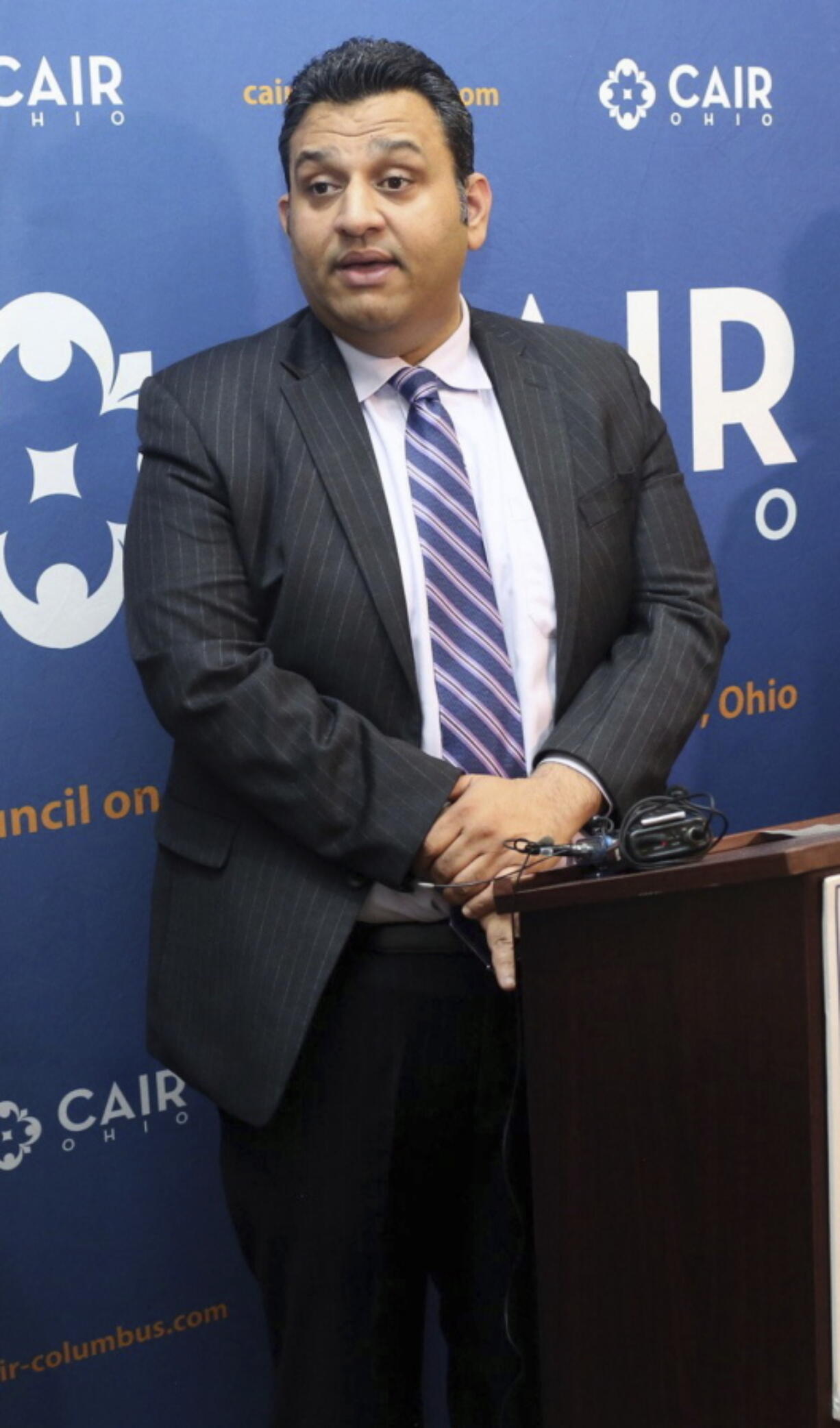 Romin Iqbal of the Council on American-Islamic Relations speaks during a news conference at CAIR-Columbus headquarters in Dublin, Ohio on July 26, 2018. An Ohio chapter of the nation's largest Muslim civil liberties and advocacy organization has fired Romin Iqbal for ethical and professional breaches that it says include a yearslong secret association with a group that has promoted anti-Muslim views.