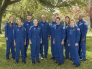 This photo provided by NASA shows its 2021 astronaut candidate class, announced on Monday, Dec. 6, 2021. The 10 candidates stand for a photo at the Johnson Space Center in Houston on Dec. 3, 2021. From left are U.S. Air Force Maj. Nichole Ayers, Christopher Williams, U.S. Marine Corps Maj. (retired.) Luke Delaney, U.S. Navy Lt. Cmdr. Jessica Wittner, U.S. Air Force Lt. Col. Anil Menon, U.S. Air Force Maj. Marcos Berr?os, U.S. Navy Cmdr. Jack Hathaway, Christina Birch, U.S. Navy Lt. Deniz Burnham, and Andre Douglas.