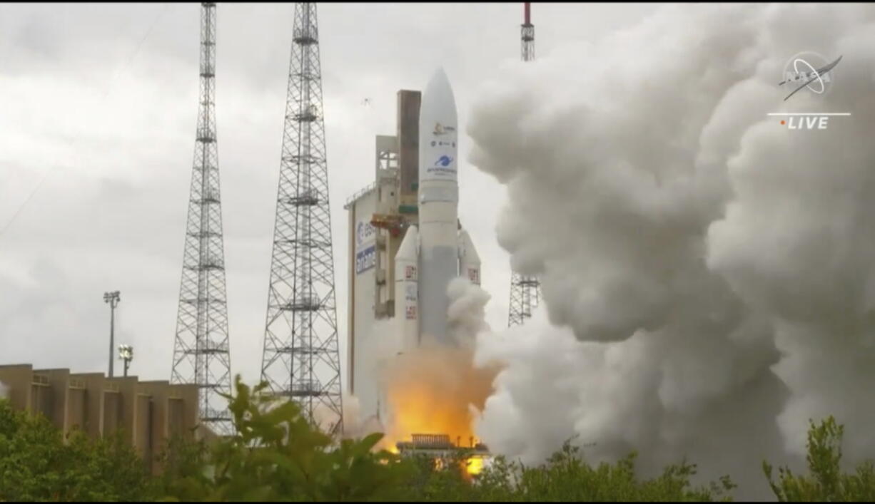 In this image released by NASA, Arianespace's Ariane 5 rocket with NASA's James Webb Space Telescope onboard, lifts off  Saturday, Dec. 25, 2021, at Europe's Spaceport, the Guiana Space Center in Kourou, French Guiana.  The $10 billion infrared observatory is intended as the successor to the aging Hubble Space Telescope.