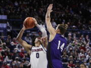 Gonzaga guard Julian Strawther (0) shoots while pressured by North Alabama forward Payton Youngblood (14) during the first half of an NCAA college basketball game, Tuesday, Dec. 28, 2021, in Spokane, Wash.