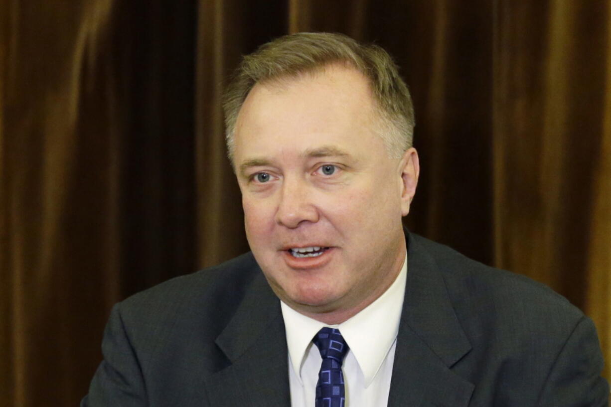 FILE - Washington Sen. Doug Ericksen, R-Ferndale, talks to reporters on Feb. 2, 2017 at the Capitol in Olympia, Wash. Ericksen died Friday, Dec. 17, 2021, after saying in November that he tested positive for COVID-19, although his cause of death was not immediately confirmed on Saturday. He was 52.  (AP Photo/Ted S.