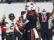 Utah running back Tavion Thomas (9) celebrates his touchdown against Oregon during the first half of the Pac-12 Conference championship NCAA college football game Friday, Dec. 3, 2021, in Las Vegas.