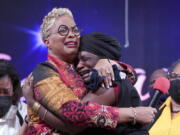 The Rev. Gina Stewart, left, senior pastor of Christ Missionary Baptist Church, comforts Hatshepsut Bandele during a church service Dec. 5 in Memphis, Tenn.